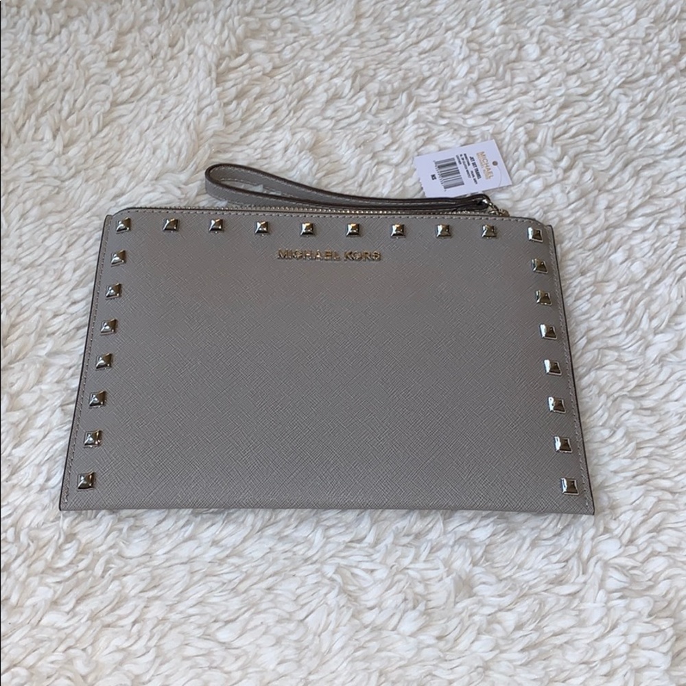 MICHAEL KORS Jet Set XL Travel studded clutch